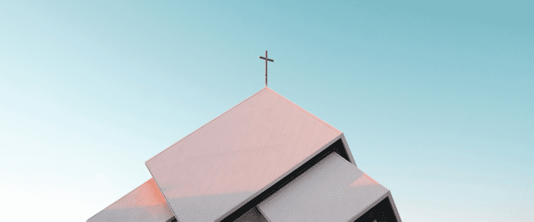 The roof of a church with a cross on top