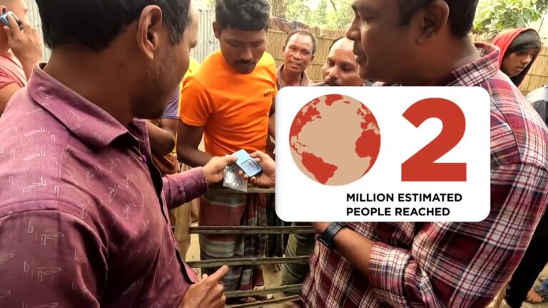 Leading The Way Field Team e distributing Navigators to a remote village